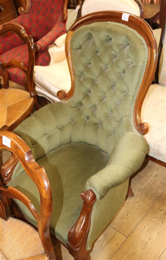 A Victorian mahogany framed buttoned back spoonback armchair